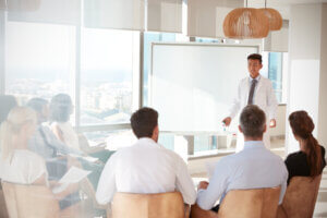 Doctor presenting information to a group of medical professionals.