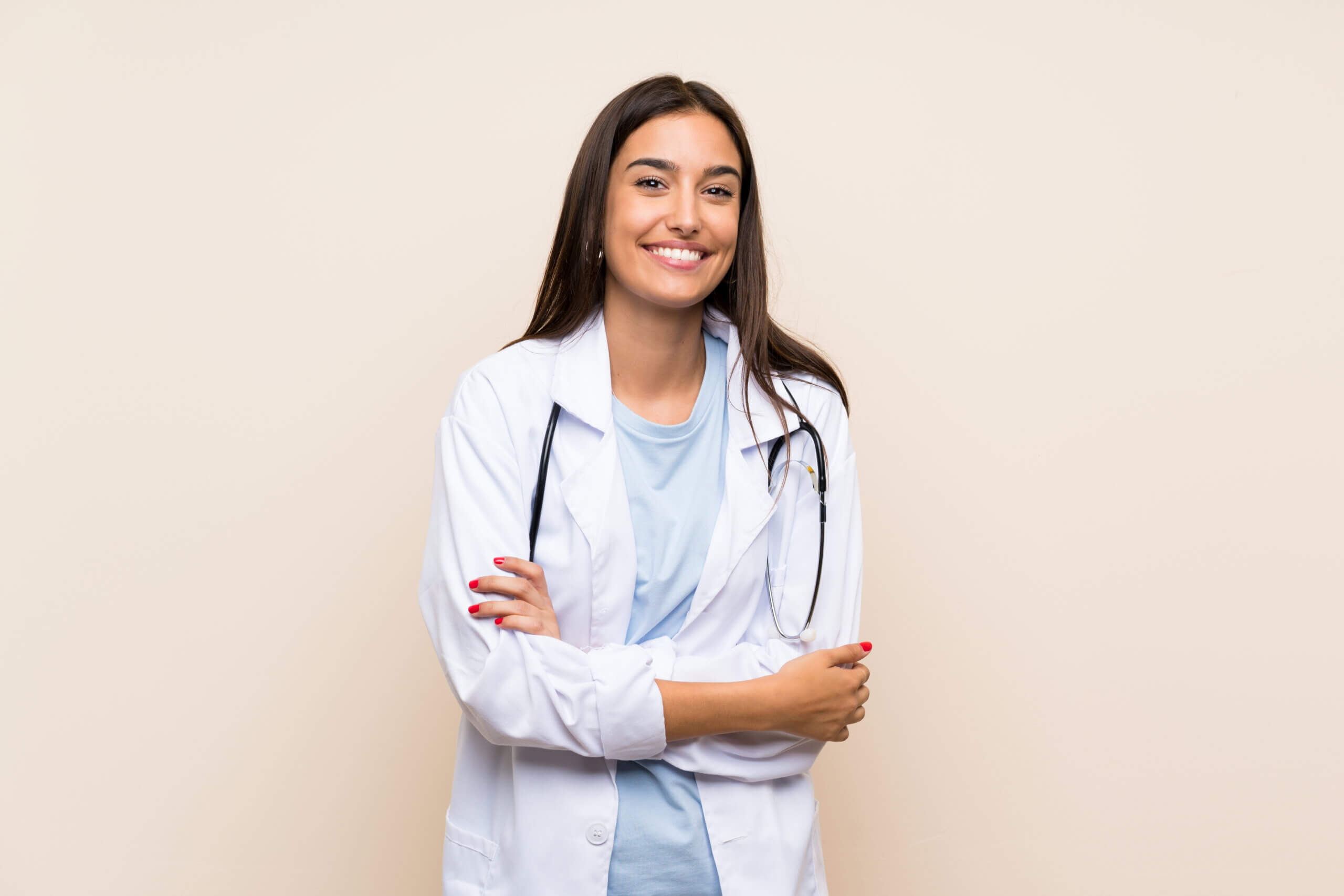 Female physician wearing a white coat and stethoscope.